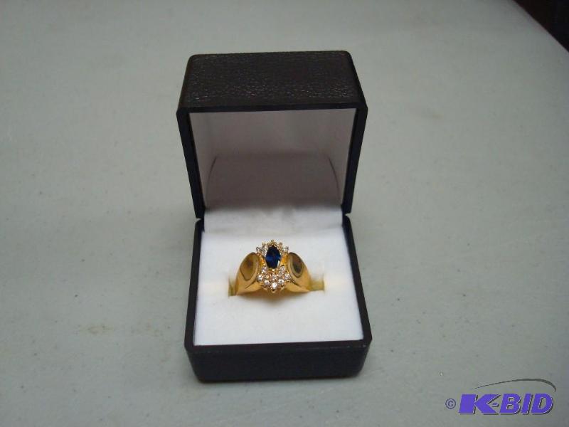Gold Tone Ring, With Blue Stone...