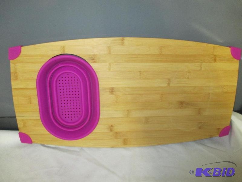 Cutting board with pop out strainer