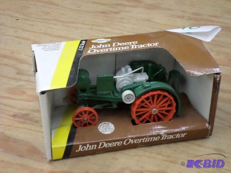 lot 110 image: John Deere 132-Scale Overtime Tractor...