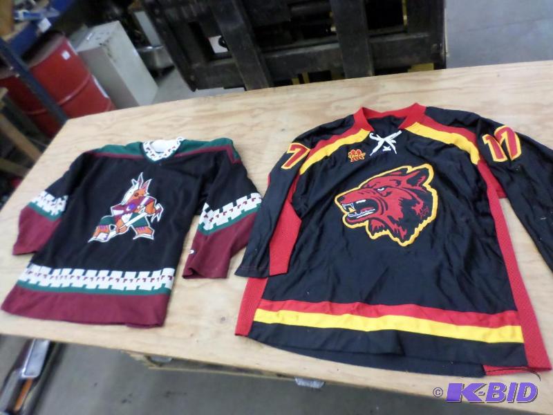 lot 158 image: (2) Size Large Hockey Jerseys...