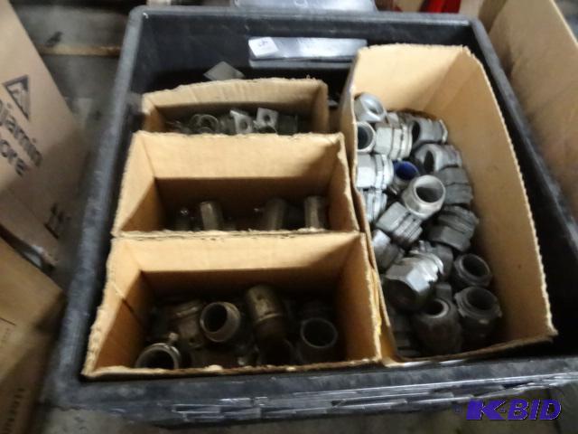 Milk crate full of conduit connectors....