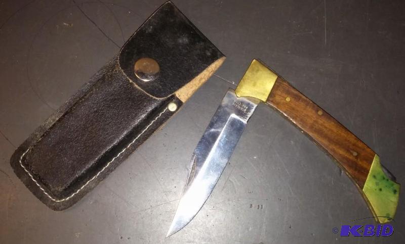 Pocket knife with leather sleeve...