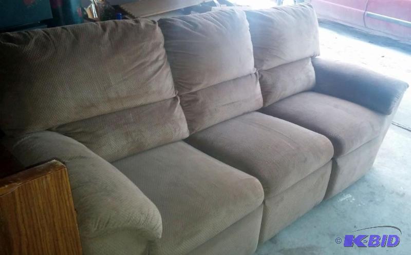 Tan Sofa with recliners on both ends...