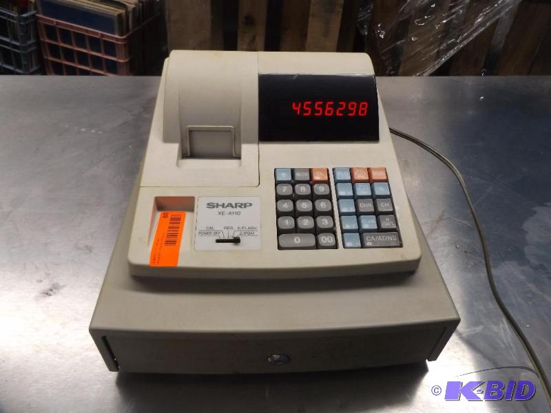 lot 80 image: Sharp Cash Register, powers up, no key...