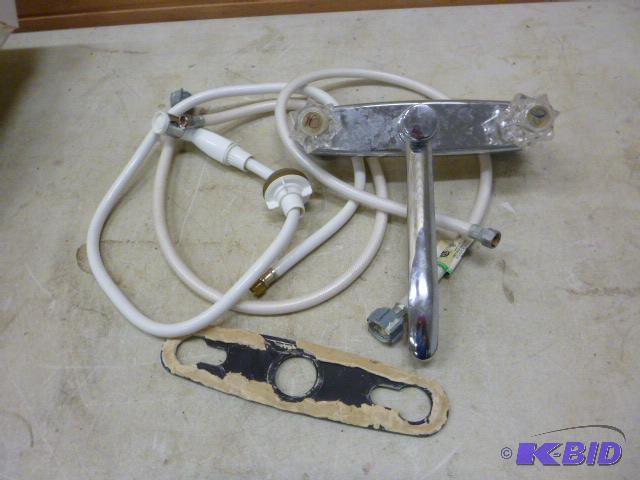 lot 131 image: Kitchen Faucet with Sprayer With water lines....