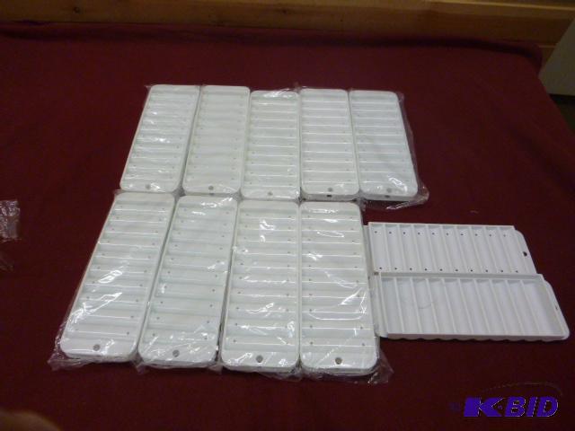 lot 135 image: Ten Narrow Ice Cube Trays for Bottles...