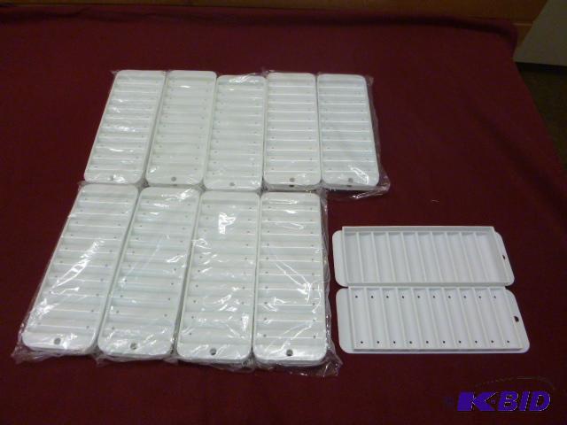 lot 141 image: Ten Narrow Ice Cube Trays for Bottles...