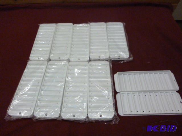 lot 142 image: Ten Narrow Ice Cube Trays for Bottles...