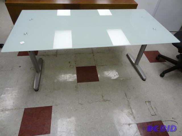 lot 125 image: Glass top desk with metal frame. 63 x 32 x 30...