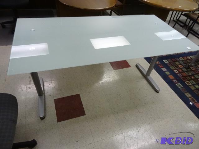 lot 70 image: Glass top desk with metal frame. 63 x 32 x 30...