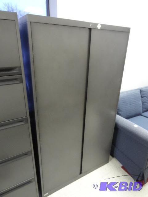 lot 9 image: 2 Door Metal Cabinet. 3 Shelves Inside. 36 X ...