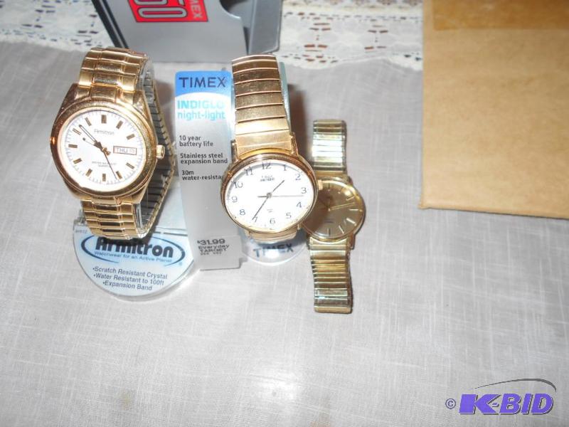lot 103 image: Three stretch band watches, gold band, two ne...