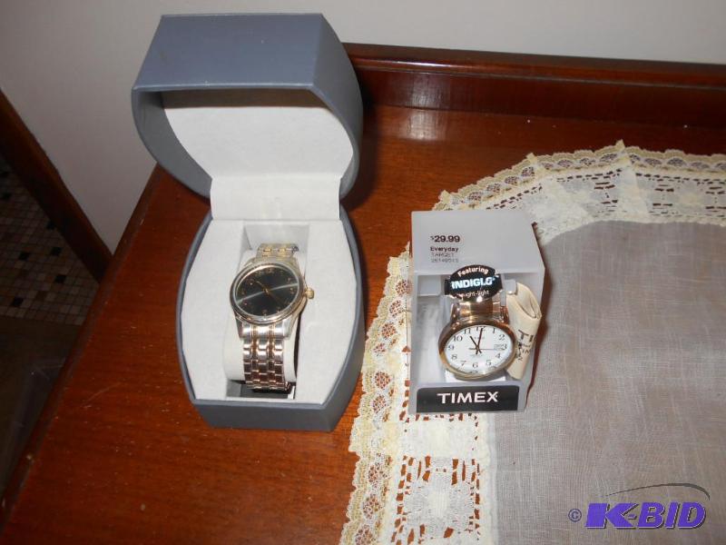 lot 105 image: Two new stretch band watches. Silver in color...