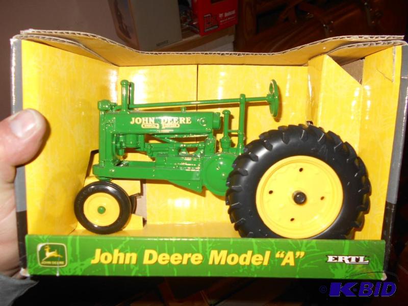 lot 123 image: John Deere Model A Toy Tractor. New in box. M...