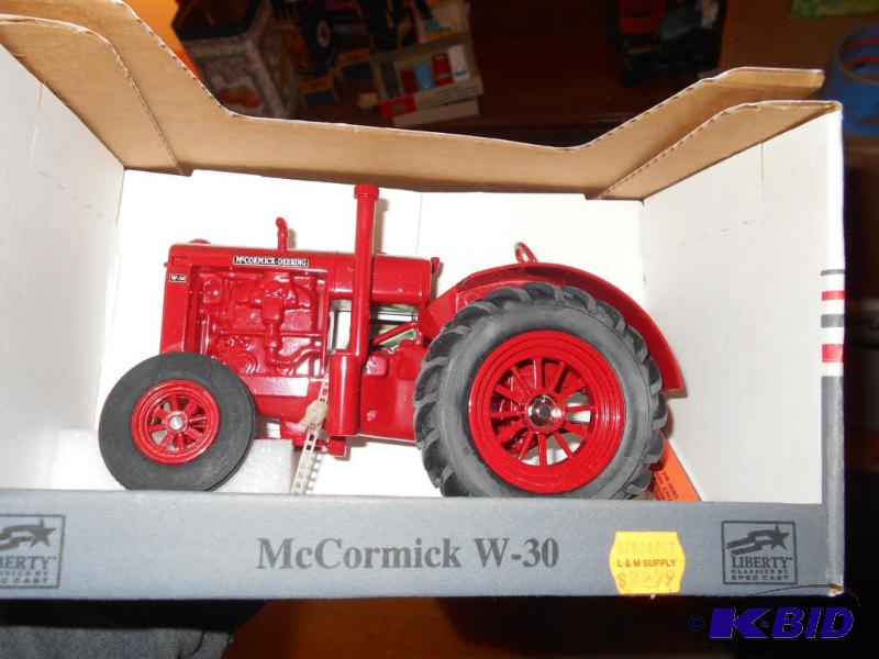 lot 138 image: McCormick w30 tractor. Metal. New in Box...