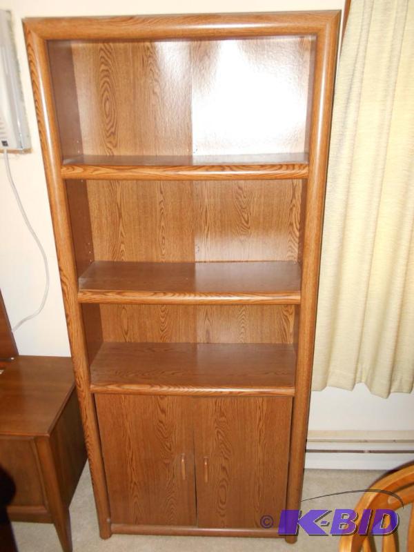 lot 19 image: Book shelf, bottom doors do not close properl...