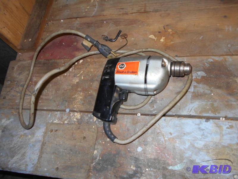 lot 204 image: Black and Decker 38 drill. 110 volt...