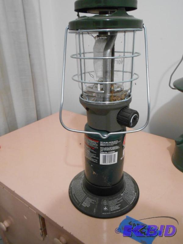 lot 291 image: Coleman lantern. Uses small propane bottle....