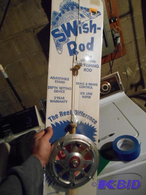 lot 309 image: Ice fishing pole. New in box...