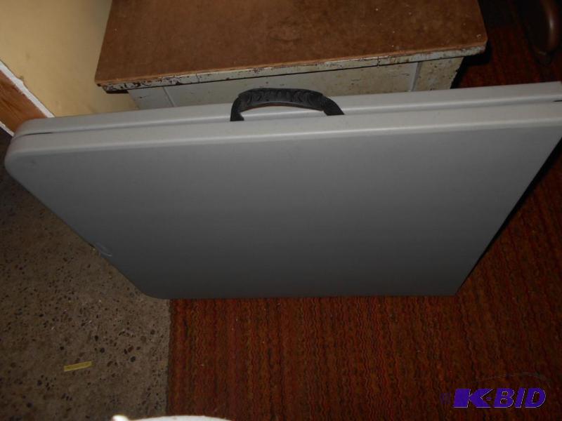 lot 64 image: Plastic folding table...