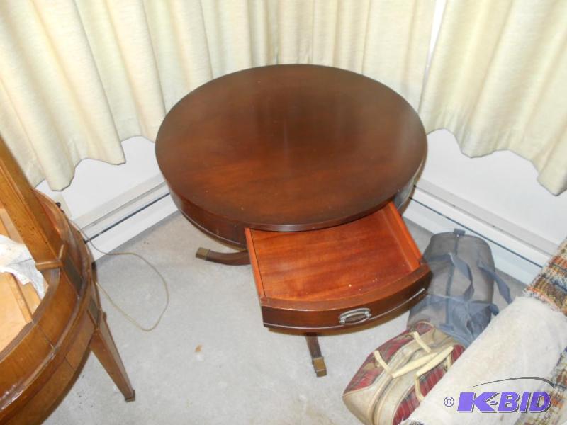 lot 8 image: Round end table with single drawer, wood, 26 ...