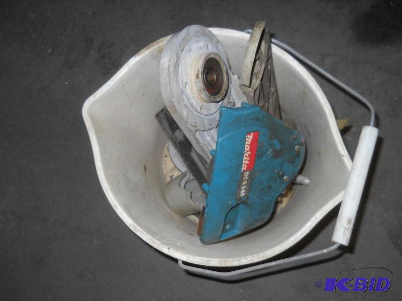 lot 25 image: Bucket of Makita Concrete Saw Parts
