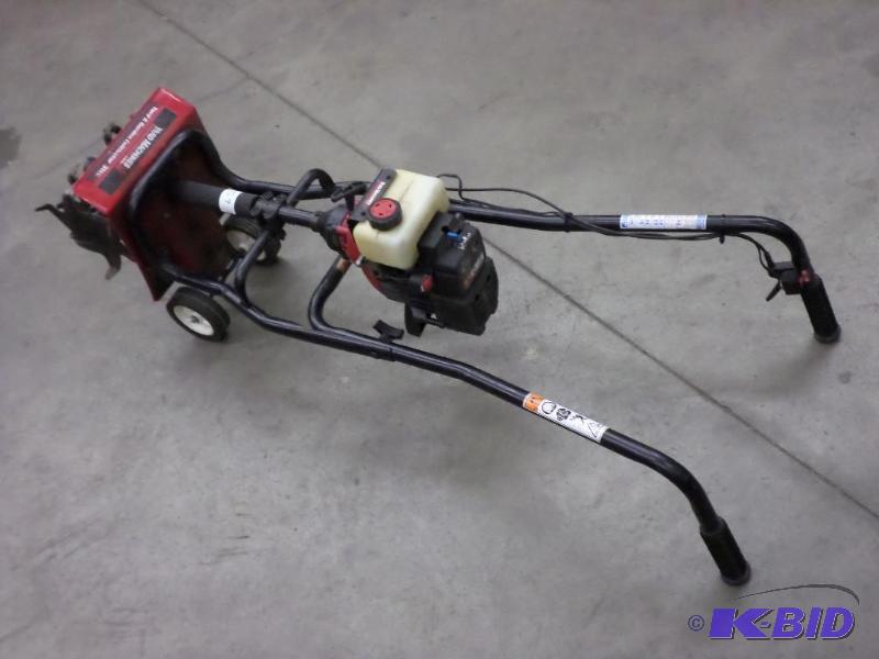 lot 59 image: Yard Machines 31cc Garden Tiller...