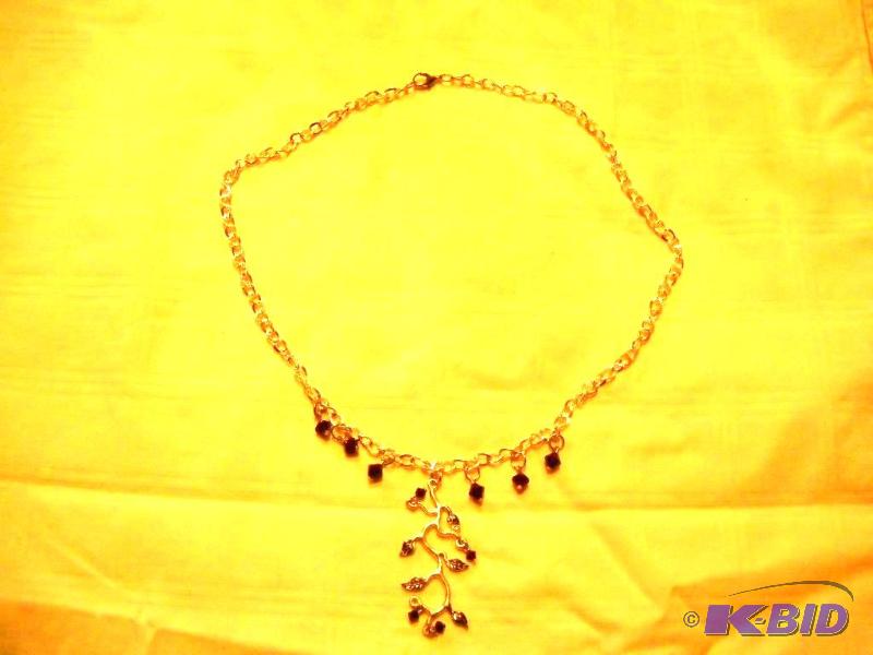 Necklace with leaf and red glass bead design....