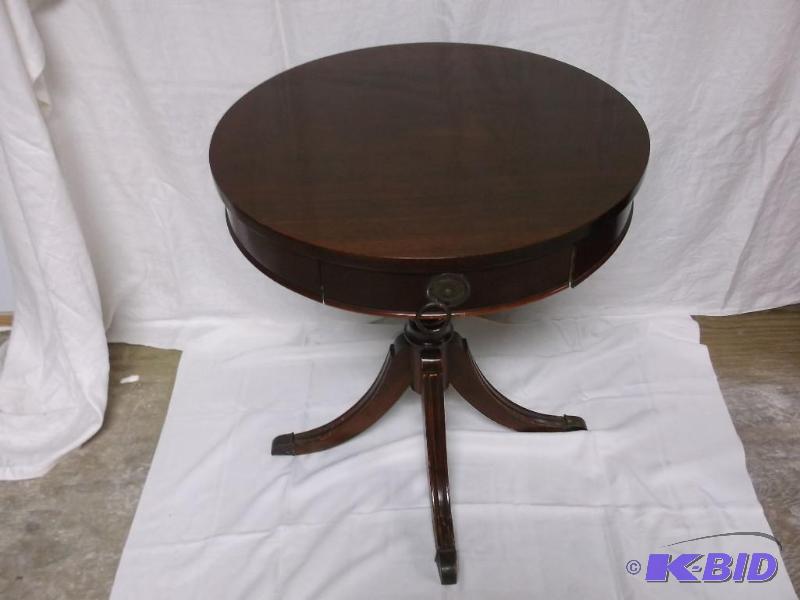 lot 3 image: Nice round end table with one drawer measurin...