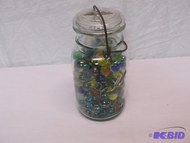 lot 73 image: Large Ball canning jar full of marbles....