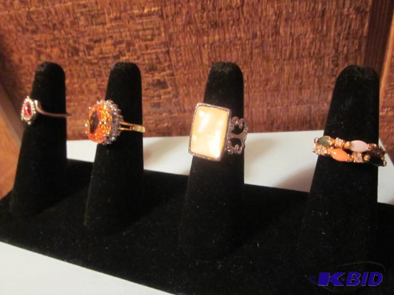 Lot of (4) decorative rings all with stones, ...
