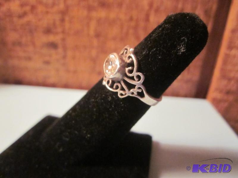 Size 5 Sterling Silver ring with one large un...