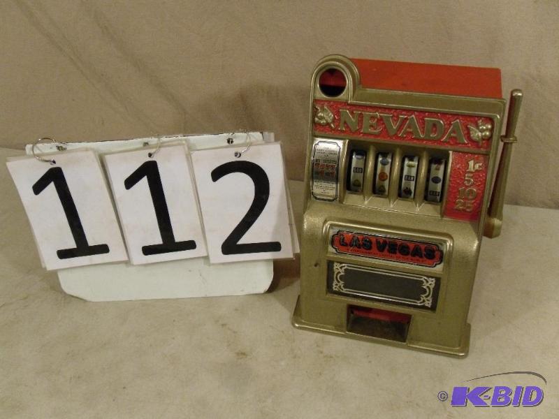 lot 112 image: Metal tabletop slot machine. You can pull the...