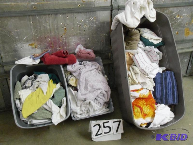 lot 257 image: 3 totes of towels. Conditions vary. Some very...