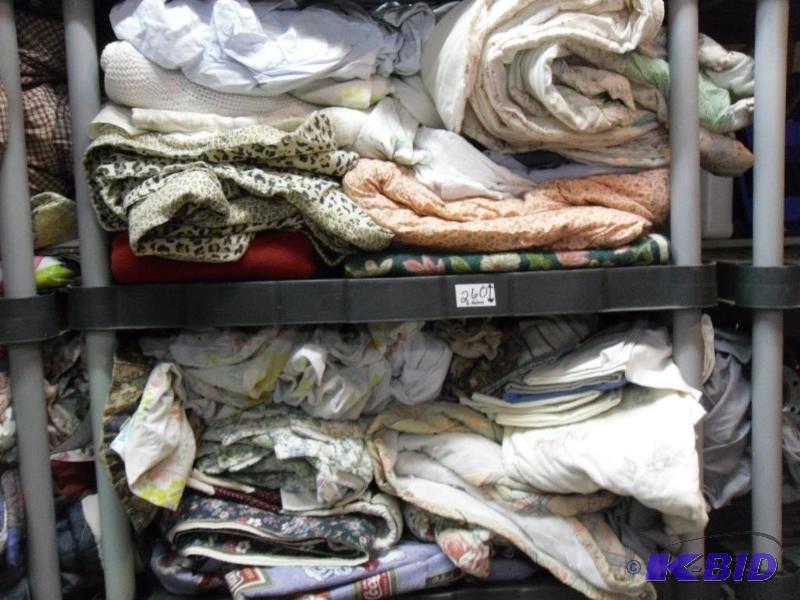 lot 260 image: 2 shelves full of assorted linens. Can be she...