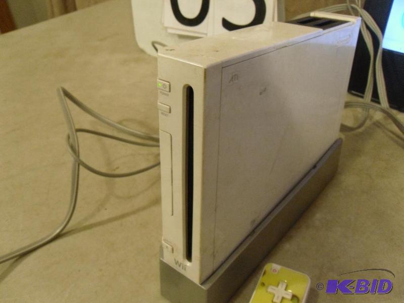lot 3 image: Nintendo Wii game console. Includes, 1 game, ...