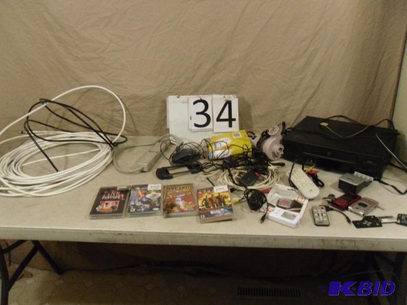 lot 34 image: Assorted electronics. Sony PSP games, VCR, co...