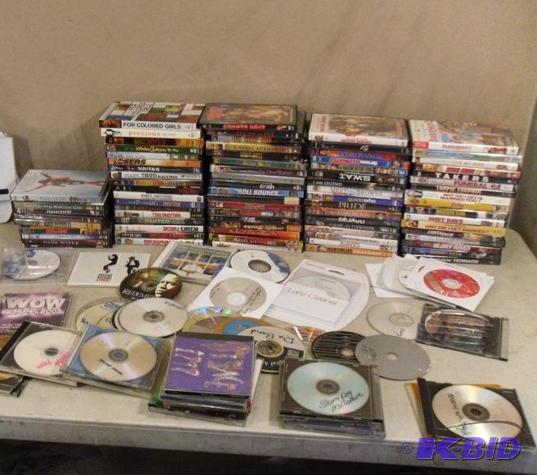 lot 35A image: Lot of Assorted DVDs, CDs, and More. Some m...