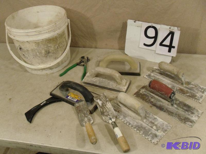 lot 94 image: Bucket of trowels, floats and more....