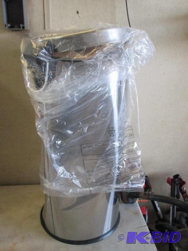 trashcan, dented...