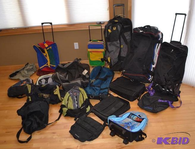 lot 142 image: Large group of duffel bags, rolling duffel ba...
