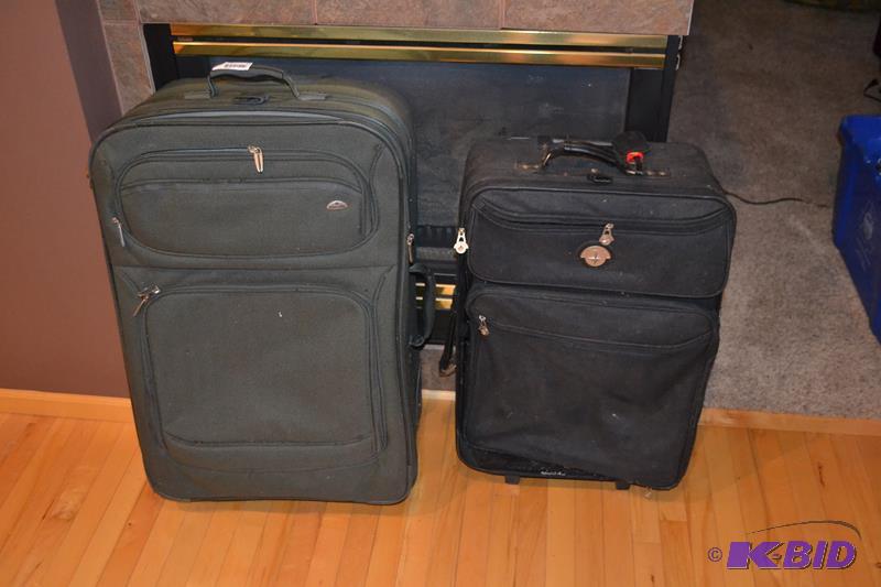 lot 32 image: 2 large suit cases with handles and wheels Sa...