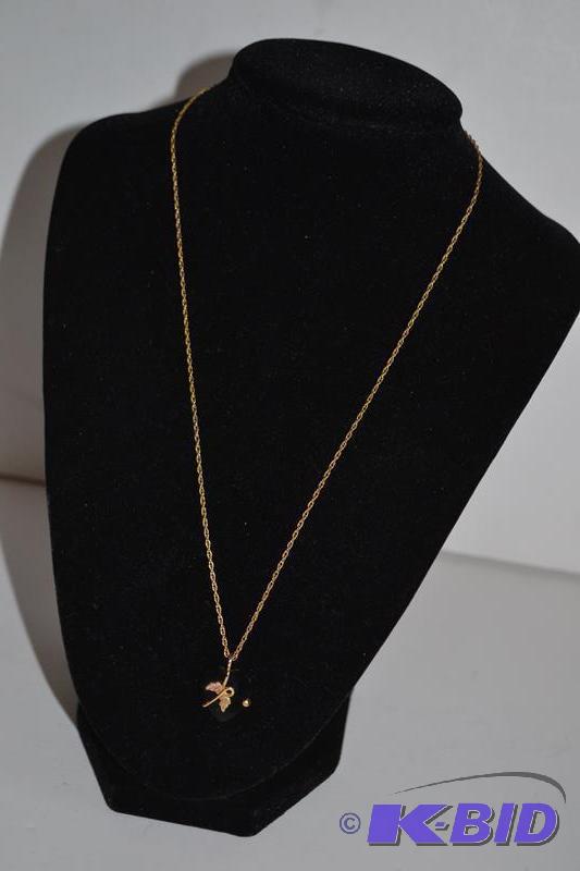 lot 59 image: Gold necklace with 12K and 10K markings...