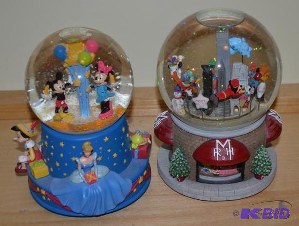 lot 93 image: 2 music box globe one is Disney the other RMH...