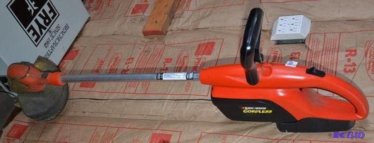 lot 27 image: Black & Decker cordless weed whip model C...
