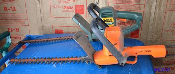 lot 34 image: Two Black & Decker hedge trimmers working...