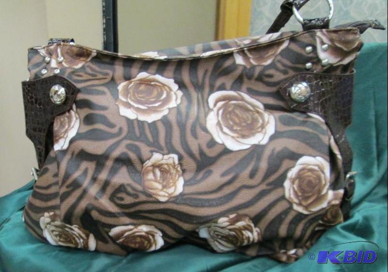 lot 100 image: One purse that is brown with roses on it...