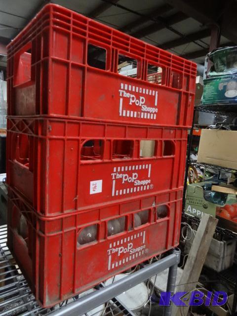4 vintage pop shoppe crates. 1 is full of bot...