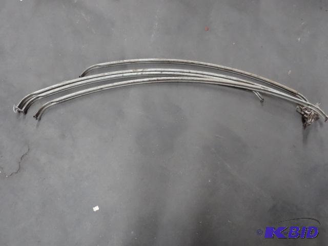 4 Vintage Metal Curtain Hangers. Bowed...