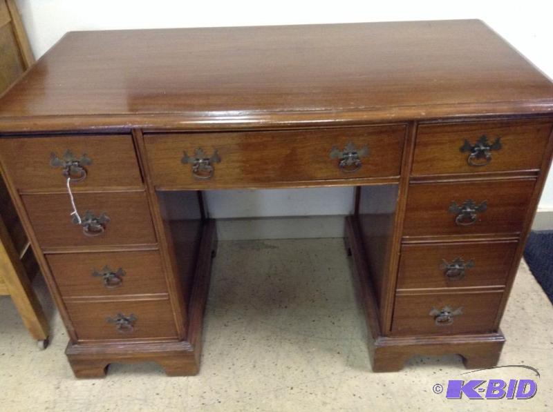 lot 15 image: Seven drawer wood desk